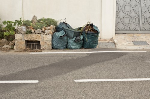 Crew member wearing PPE while handling waste materials